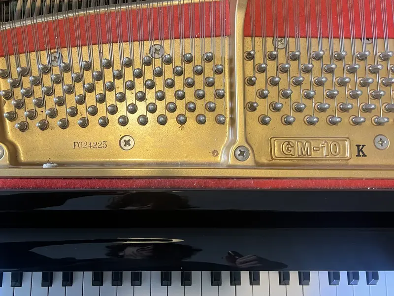 Serial number on a Kawai GM-10 grand piano